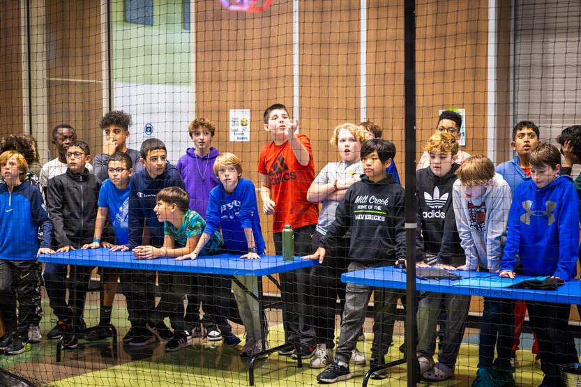 Middle and high school students learning about drone soccer